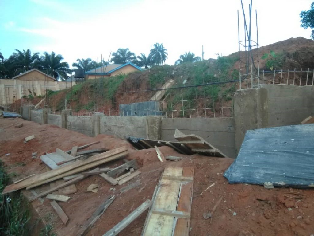 Casted ground beam with reinforced iron rods to allow block wall on it