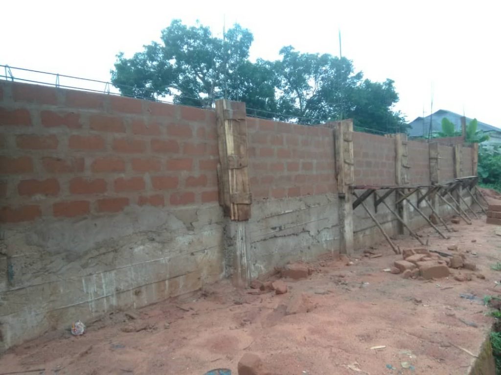The fence wall on waterlogged area of the boundary wall 